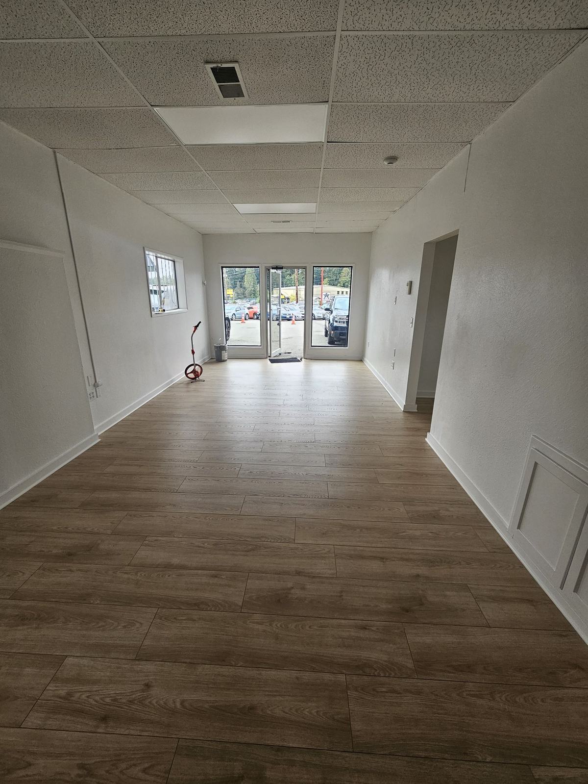 Open customer area with new flooring and glass entry doors
